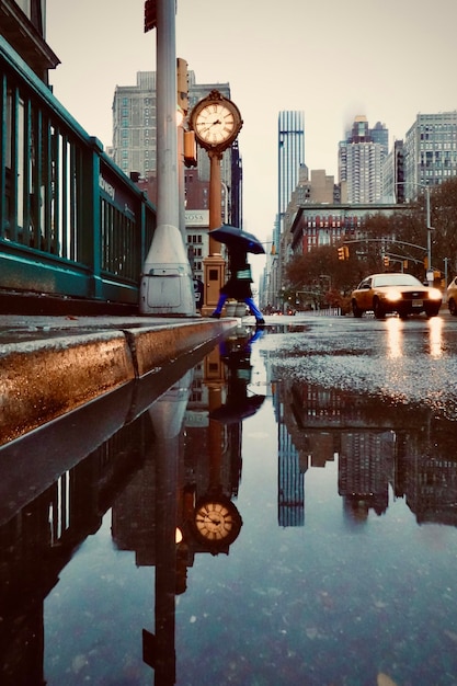 Reflection of buildings in puddle