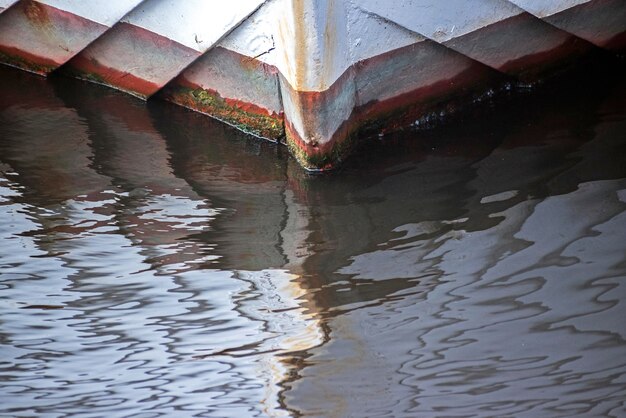 Reflection of built structure in puddle