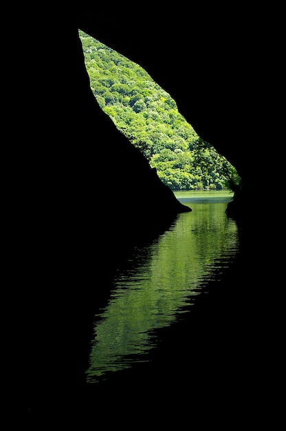 Reflection of a cave entrance in the water