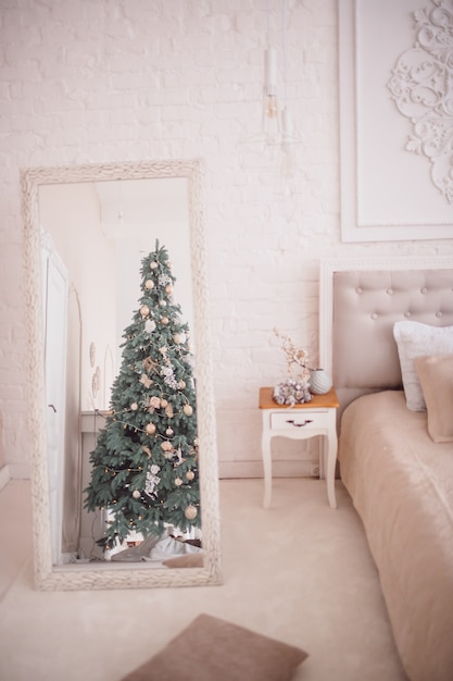 Photo reflection of a christmas tree in a mirror