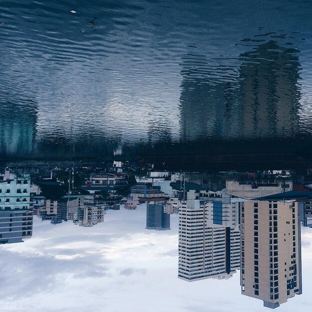 Photo reflection of city in water