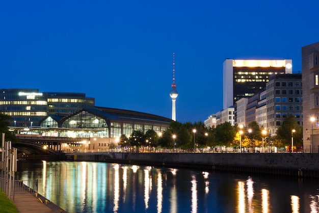 Reflection of illuminated buildings in city at night