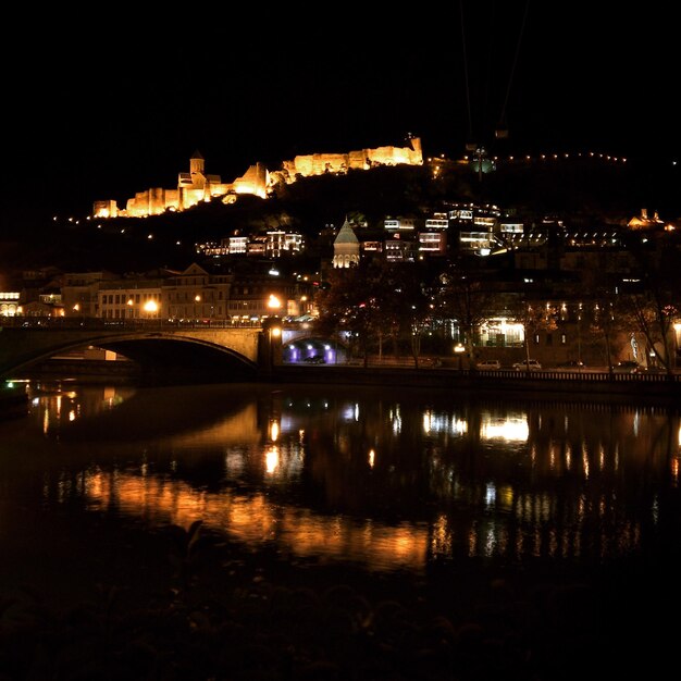 Reflection of illuminated buildings in water at night