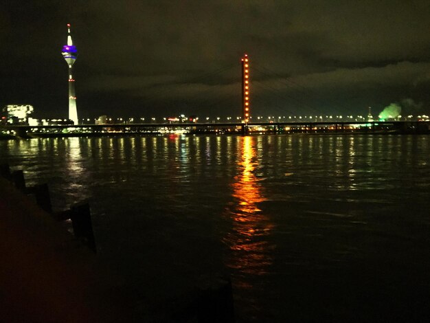 Reflection of illuminated buildings in water at night