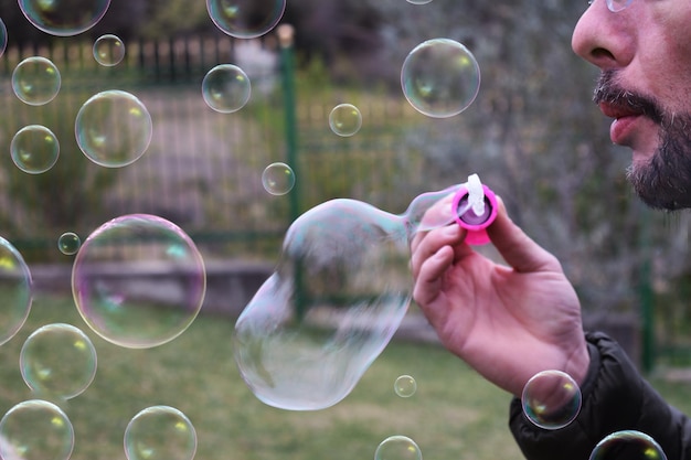 Photo reflection of man in bubbles