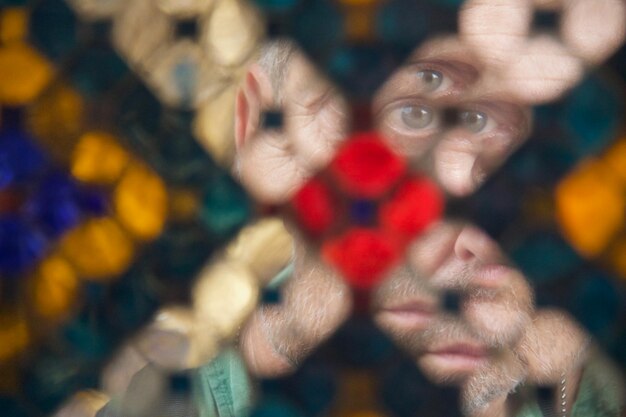 Reflection of man on defocused decoration