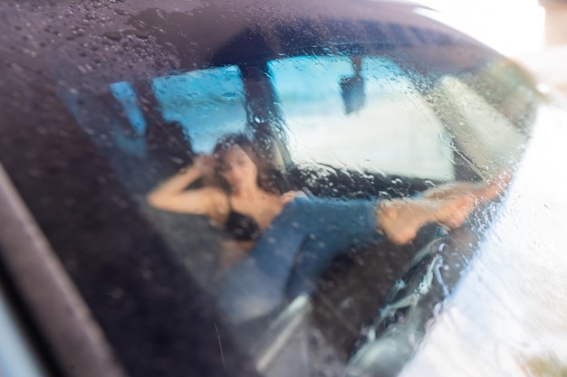 Photo reflection of man on glass window