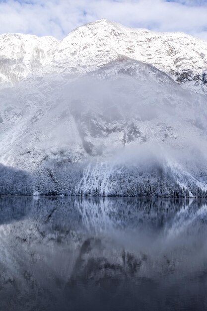 Reflection of the mountains of the shore in the mountain lake