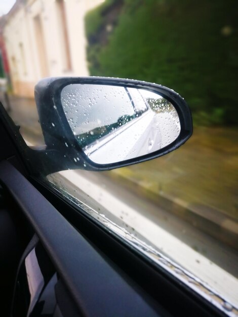 Reflection of side-view mirror of car