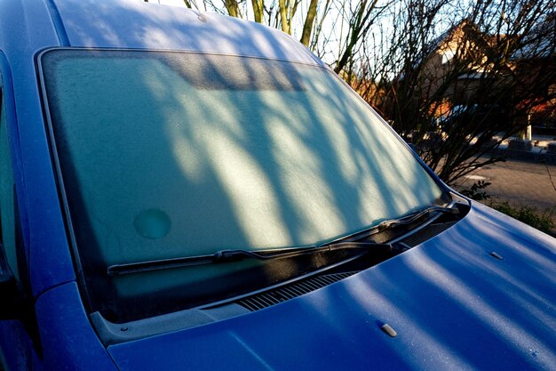 Reflection of sky on side-view mirror of car