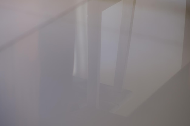 Reflection of some wood furniture on wet floor tiles