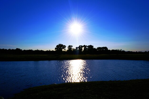 Reflection of sun in river