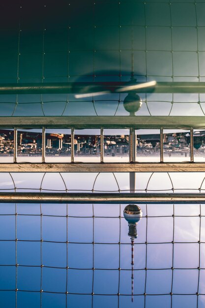 Photo reflection of swimming pool on glass window