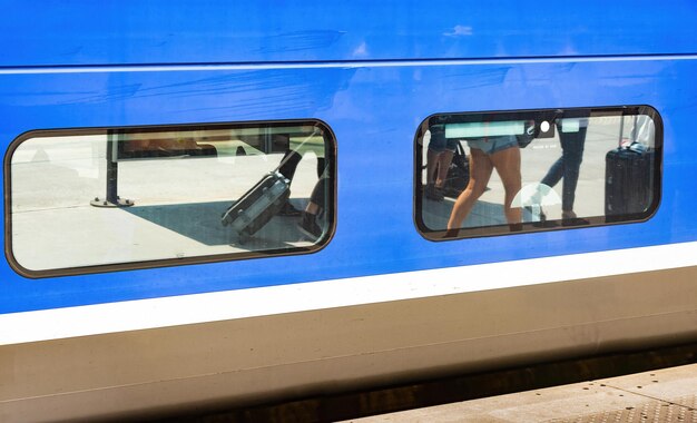 Reflection of train on glass window