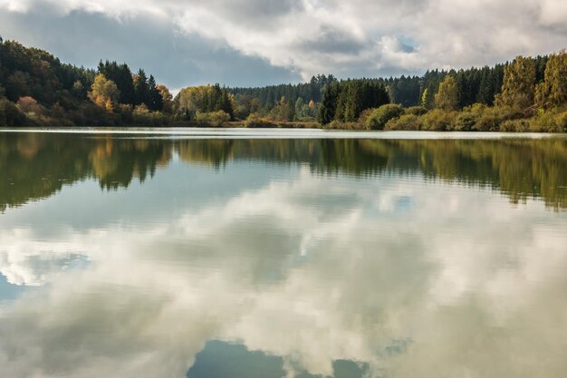 Reflection of trees in lake against sky