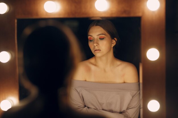 Photo reflection of woman in mirror