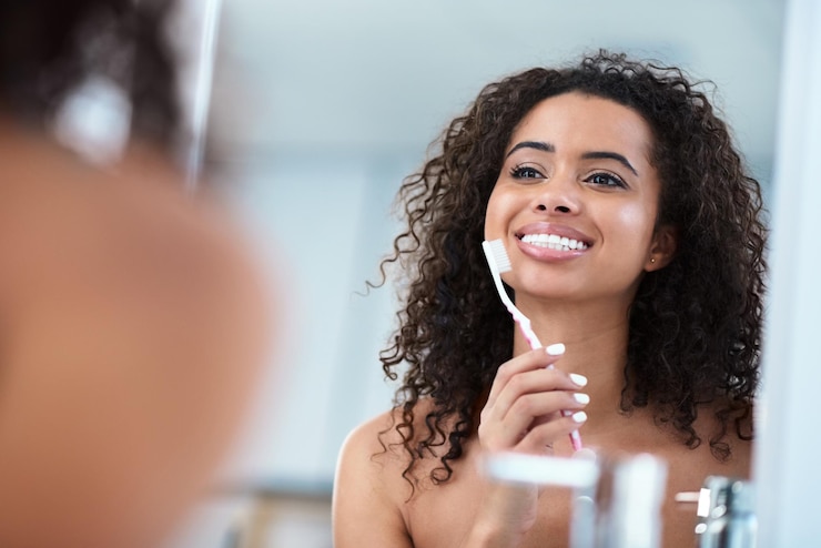 Photo reflection woman and toothbrush in bathroom for dental care hygiene and wellness for morning mirror female person and smile for health glow and cosmetics for mouth or routine in home or house