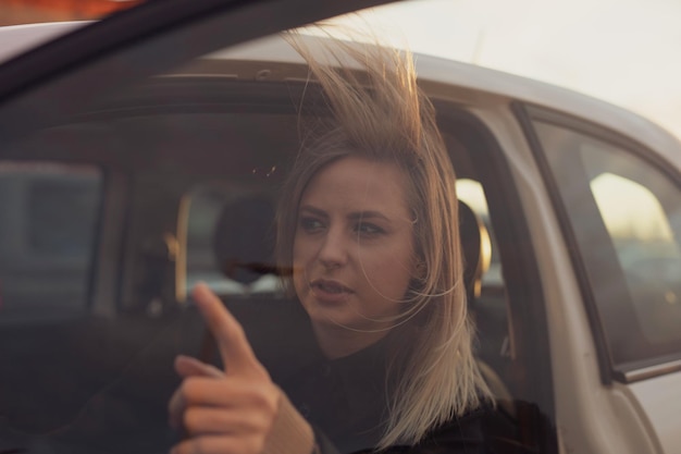 Photo reflection of young woman in car