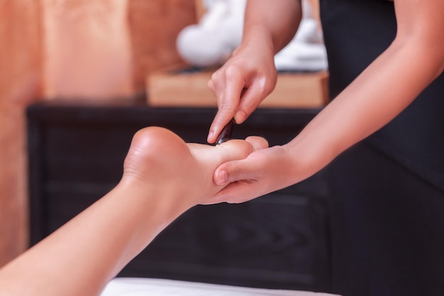 reflexology thai foot massage spa foot treatment by wood stickThailand