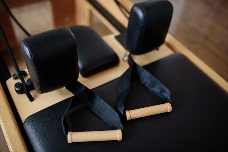Reformer pilates studio machine for fitness workouts in gym