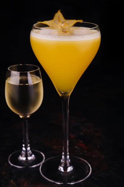 Refreshing carambola martini cocktail with champagne