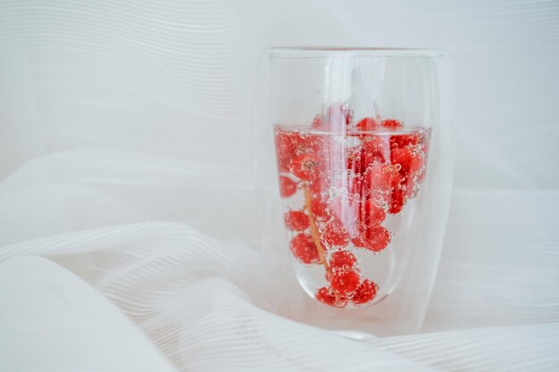 Refreshing carbonated drink with currant berries detox and
summer concept, copy space