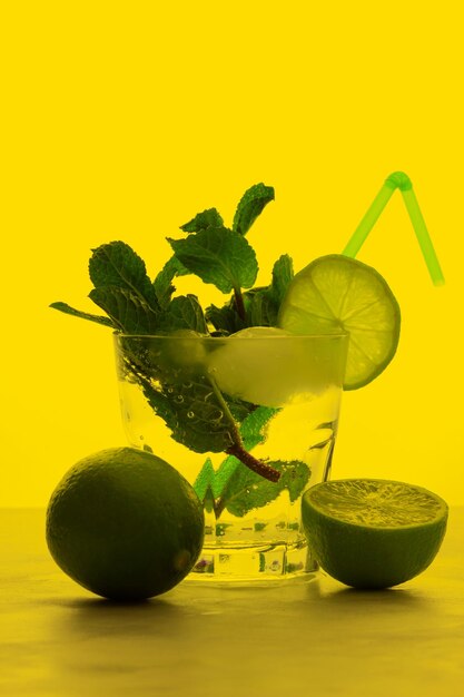 Refreshing citrus cocktail with mint on a bright colored background Healthy citrus summer drink Closeup