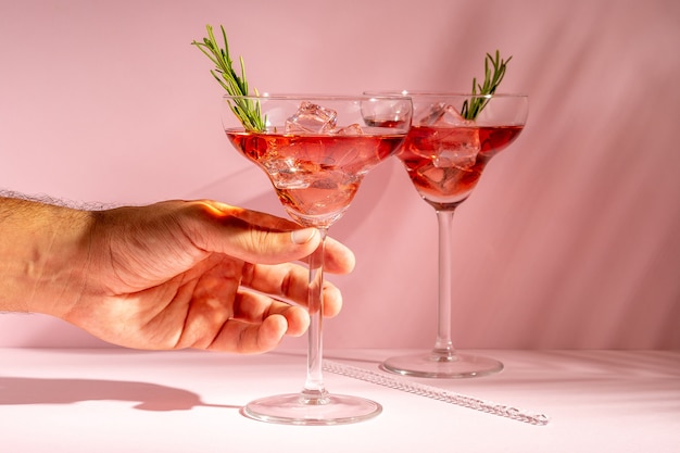 Refreshing cocktail with rosemary in a glass