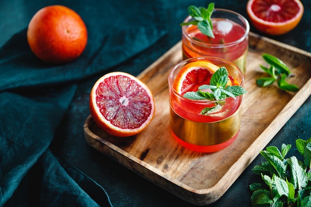 Refreshing cold summer cocktail with blood orange and mint