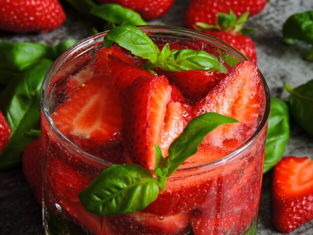 Refreshing detox drink with strawberries and basil.