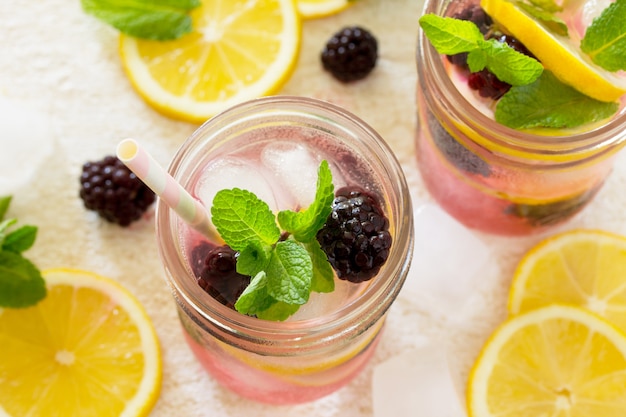 Refreshing drink with blackberries, lemon and mint