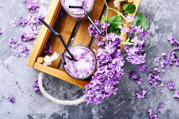 Refreshing drink with lilac and ice