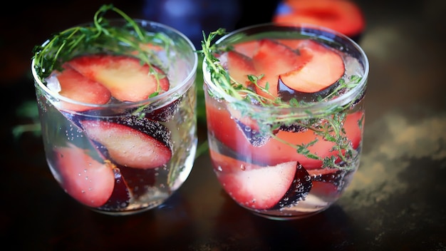 A refreshing drink with mineral water and plums