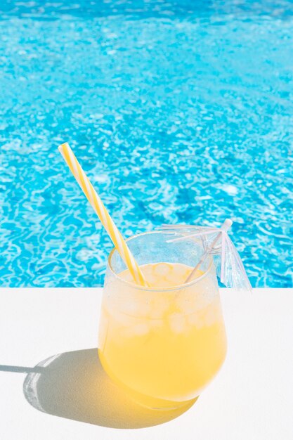 A refreshing fruit juice by the pool summer concept holidays and food