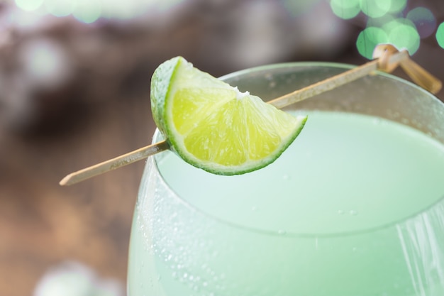 Refreshing green cocktail, summer drink with lime in a glass