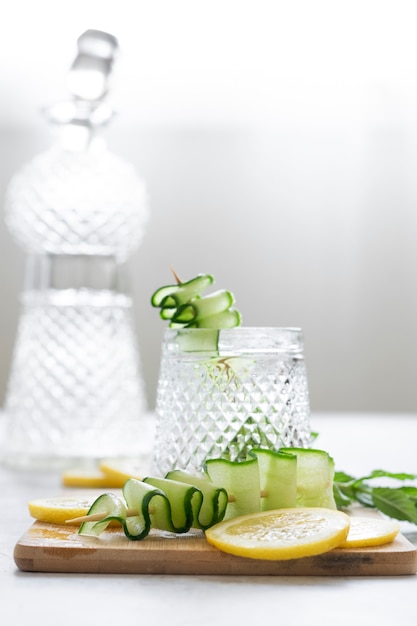 Refreshing iced drink with lemon and cucumber