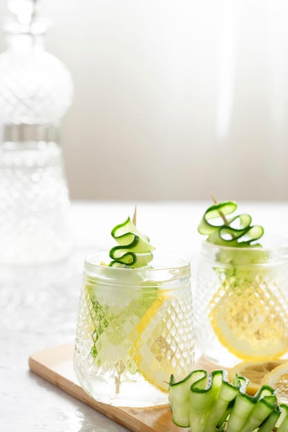 Refreshing iced drink with lemon and cucumber