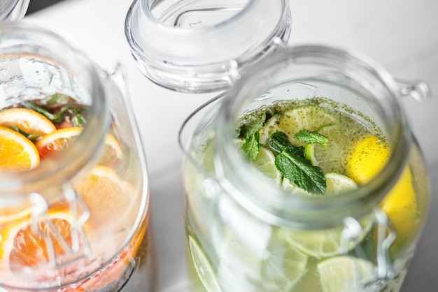 Refreshing lemonade with lime juice and lemon in glass jars Concept of drinks summer bar rest healthy food