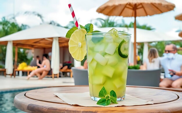 Refreshing mojito with fruit and umbrella at outdoor entertainment club