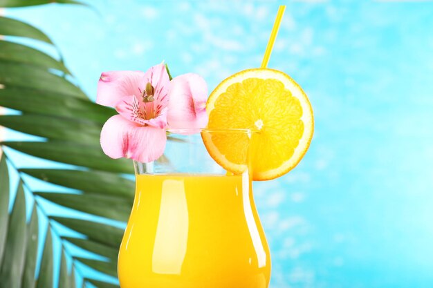 Refreshing orange cocktail on beach table