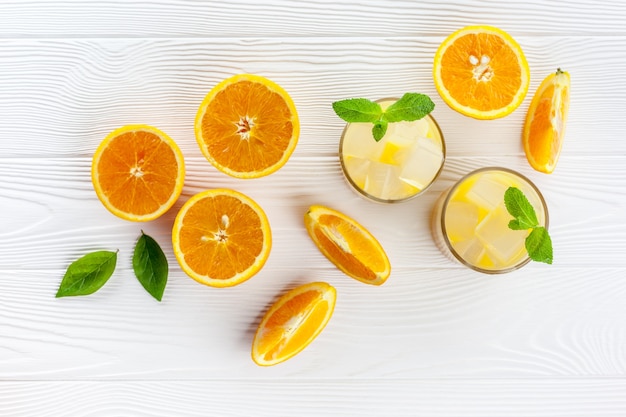 Refreshing orange juice with ice cubes