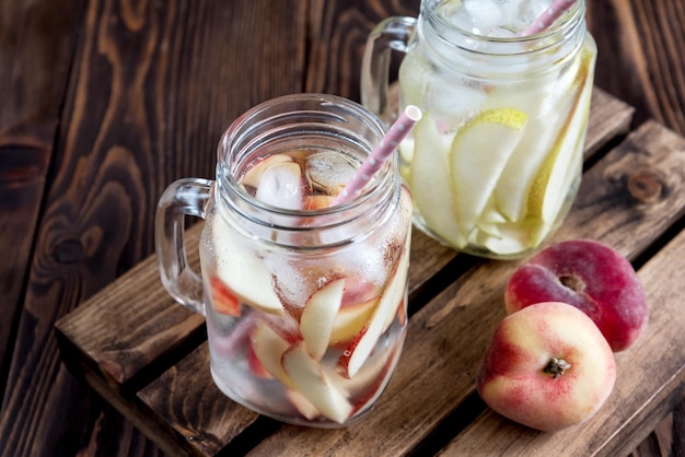 Refreshing peach drink cold pear drink infused water cold fruit lemonade rustic