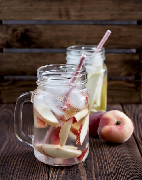 Refreshing peach drink Cold pear drink Infused water Cold fruit lemonade Rustic