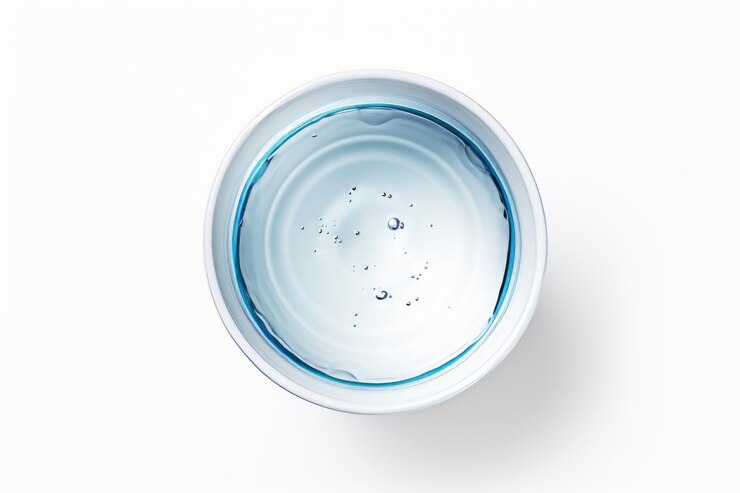 Refreshing Simplicity A Serene TopView of a Cup of Water on a White Background