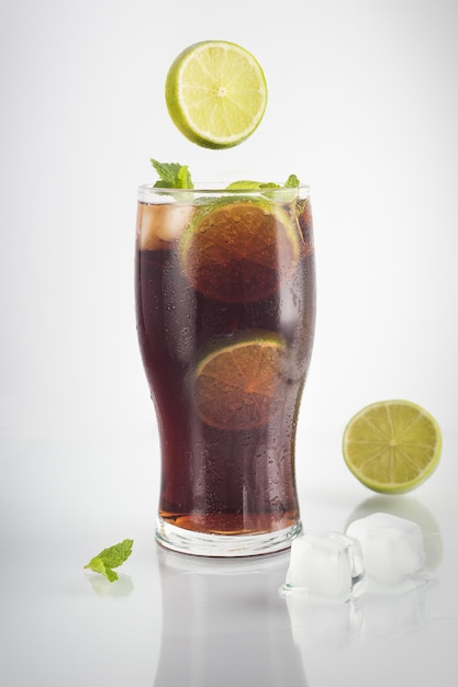 Refreshing splashing cocktails isolated on a white background Mojito cocktail on white background