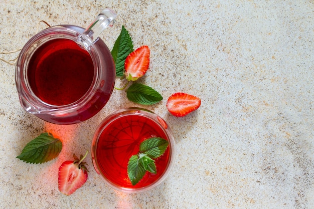 A refreshing strawberry drink with copy space on a brown stone