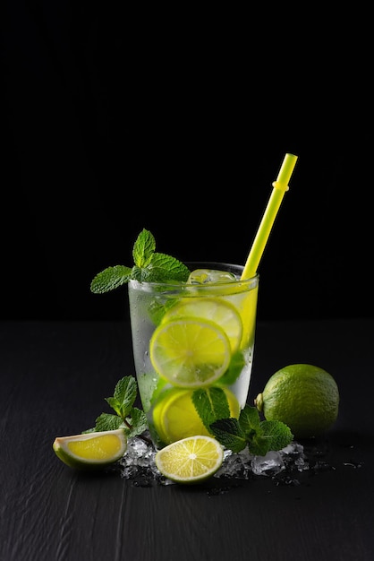 Refreshing summer alcoholic cocktail mojito with ice fresh mint and lime