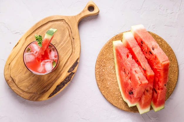 A refreshing summer drink of watermelon juice with lime and ice