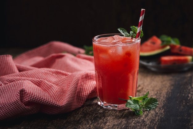 Refreshing summer watermelon juice in glasses with slices of watermelon