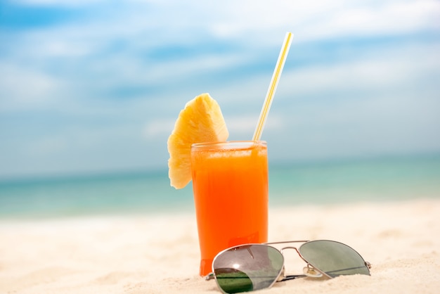 Refreshing tropical fruit juice drink at summer beach